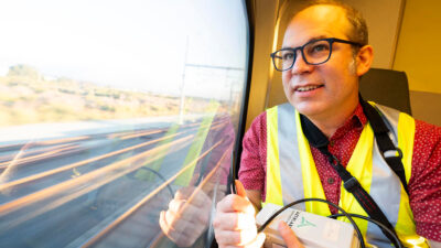 Professor Joshua Apte measures air quality aboard a diesel train bound for San Jose from San Francisco. (Photo by Adam Lau/Berkeley Engineering)