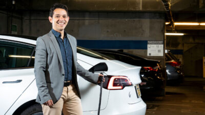 Civil and environmental engineering professor Scott Moura demonstrates SlrpEV, a research project developing next-generation intelligent EV charging stations, at UC Berkeley's RSF parking garage in Berkeley, Calif. on Monday, March 13, 2023.
