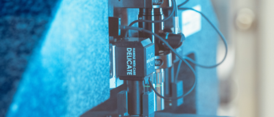 lab machinery close up with text that says handle with care delicate