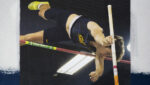 Mechanical engineering student Will Siemens competing on pole vault.