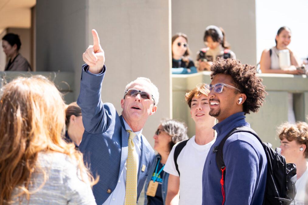 Alumnus and donor Michael Grimes points out features on the new Grimes Engineering Center to students