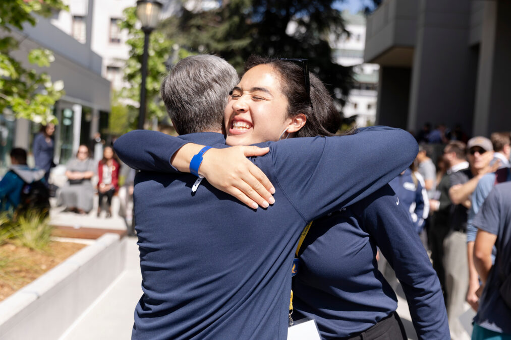 Attendees hug outside the Grimes Engineering Center