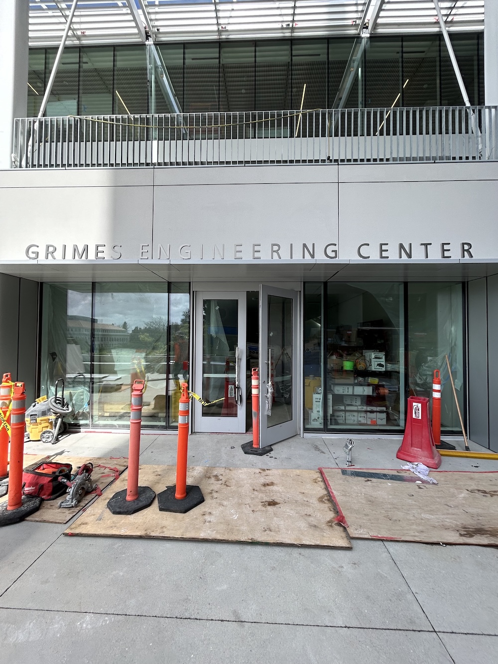Grimes Engineering Center building name on top of the entrance of a white building that is under construction