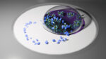 An illustration shows a ring of small purple particles, representing disease proteins, sitting on a surface. The ring is partially covered by a droplet of liquid containing enlarged cartoons of plasmonic particles.