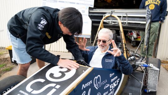 Chancellor Rich Lyons is seated in a Formula Electric racing car during open house at Richmond Field Station. (Photo by Adam Lau/Berkeley Engineering)