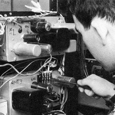 Man working on radio station equipment