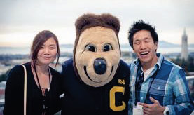 Oski with students on the Memorial Stadium deck overlooking campus